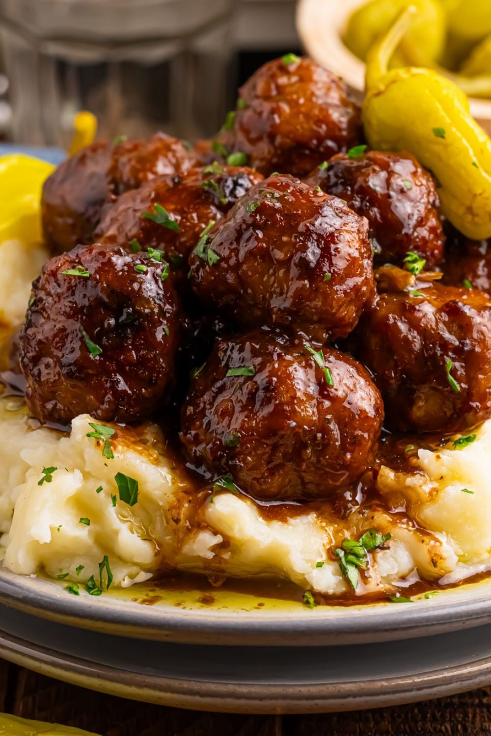 Crockpot Mississippi Meatballs piled on a plate with mashed potatoes