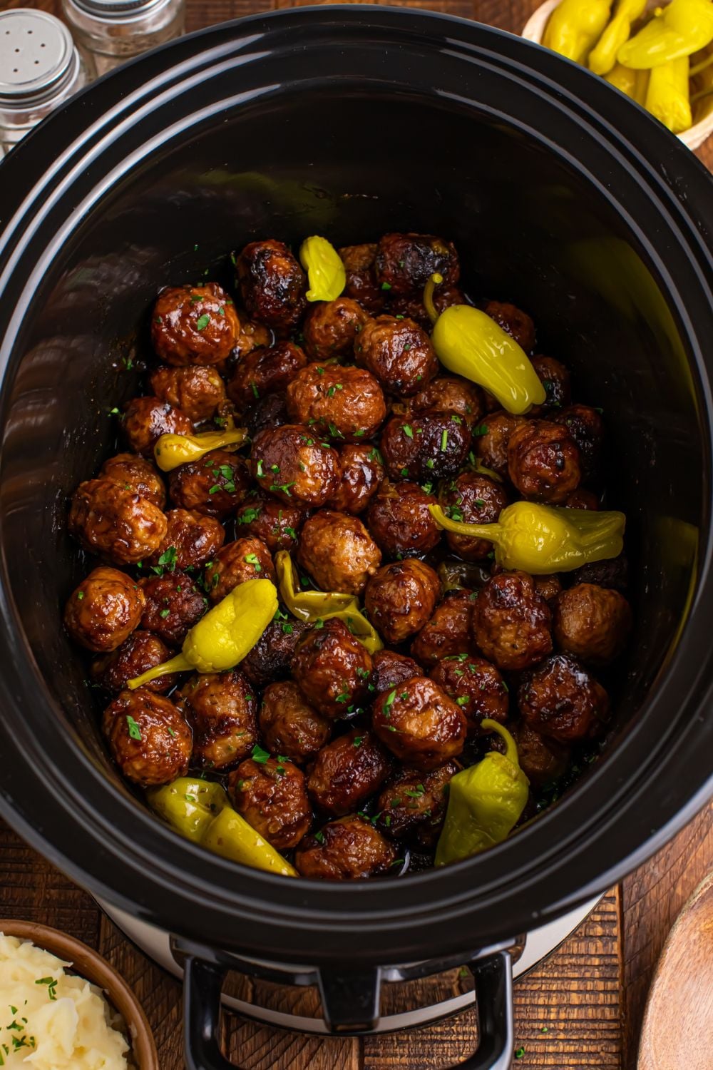 overhead look at the table with a Crockpot with Mississippi Meatballs in it
