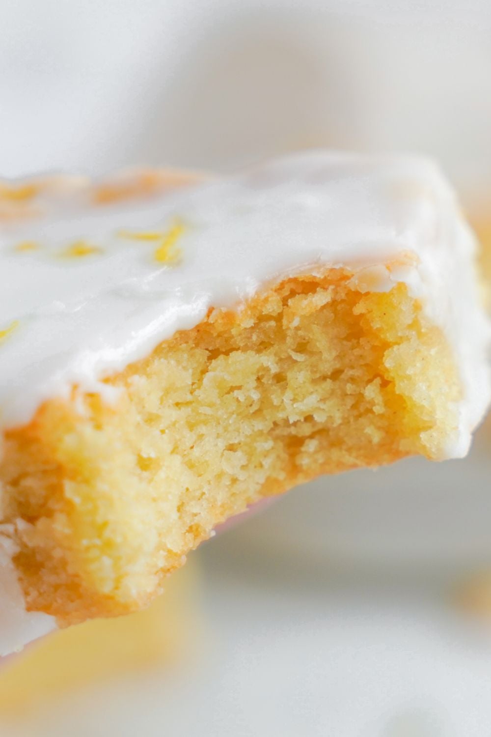 Lemon Sugar Cookie Bar with a bite taken out of it