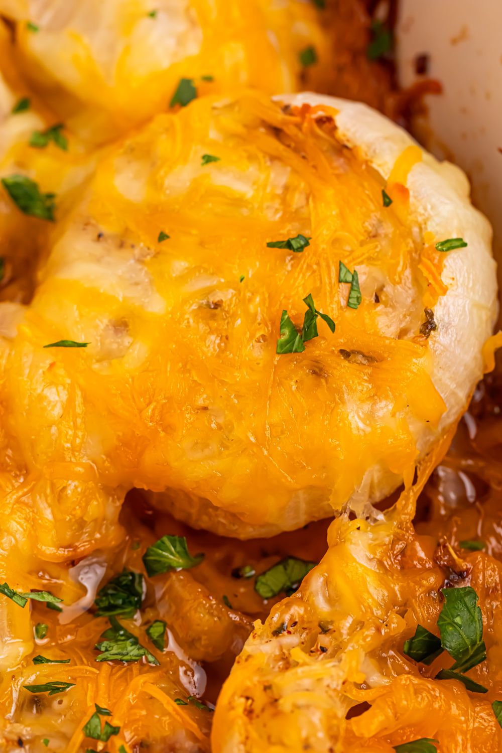 Cheesy Tennessee Onions on table with some parsley on top