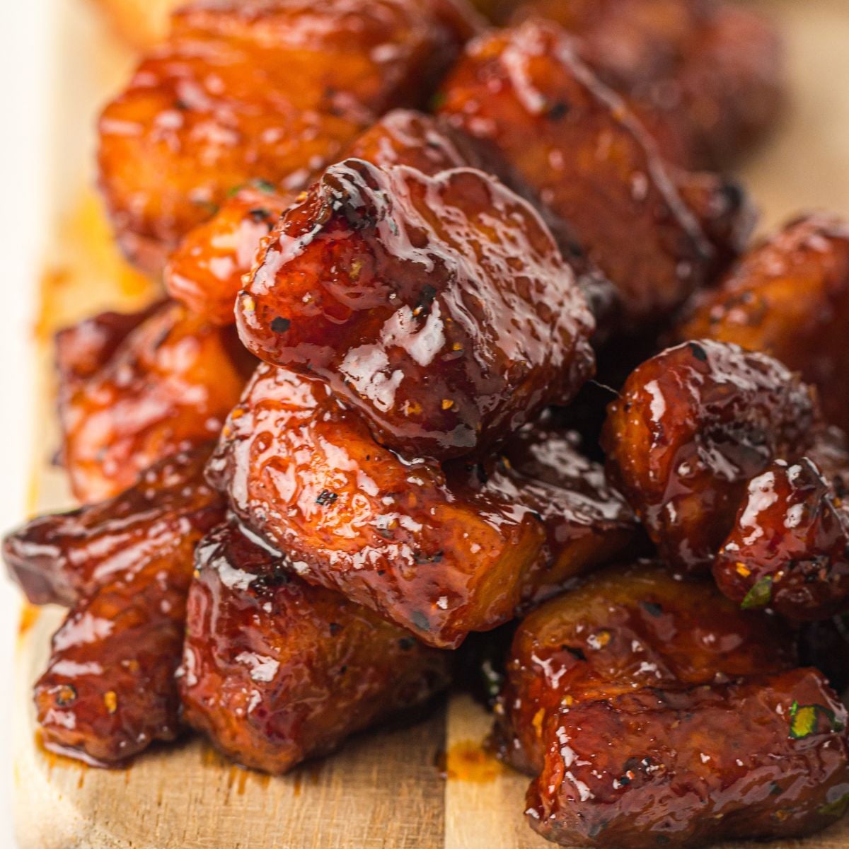 Smoked Pork Belly Burnt Ends on a cutting board