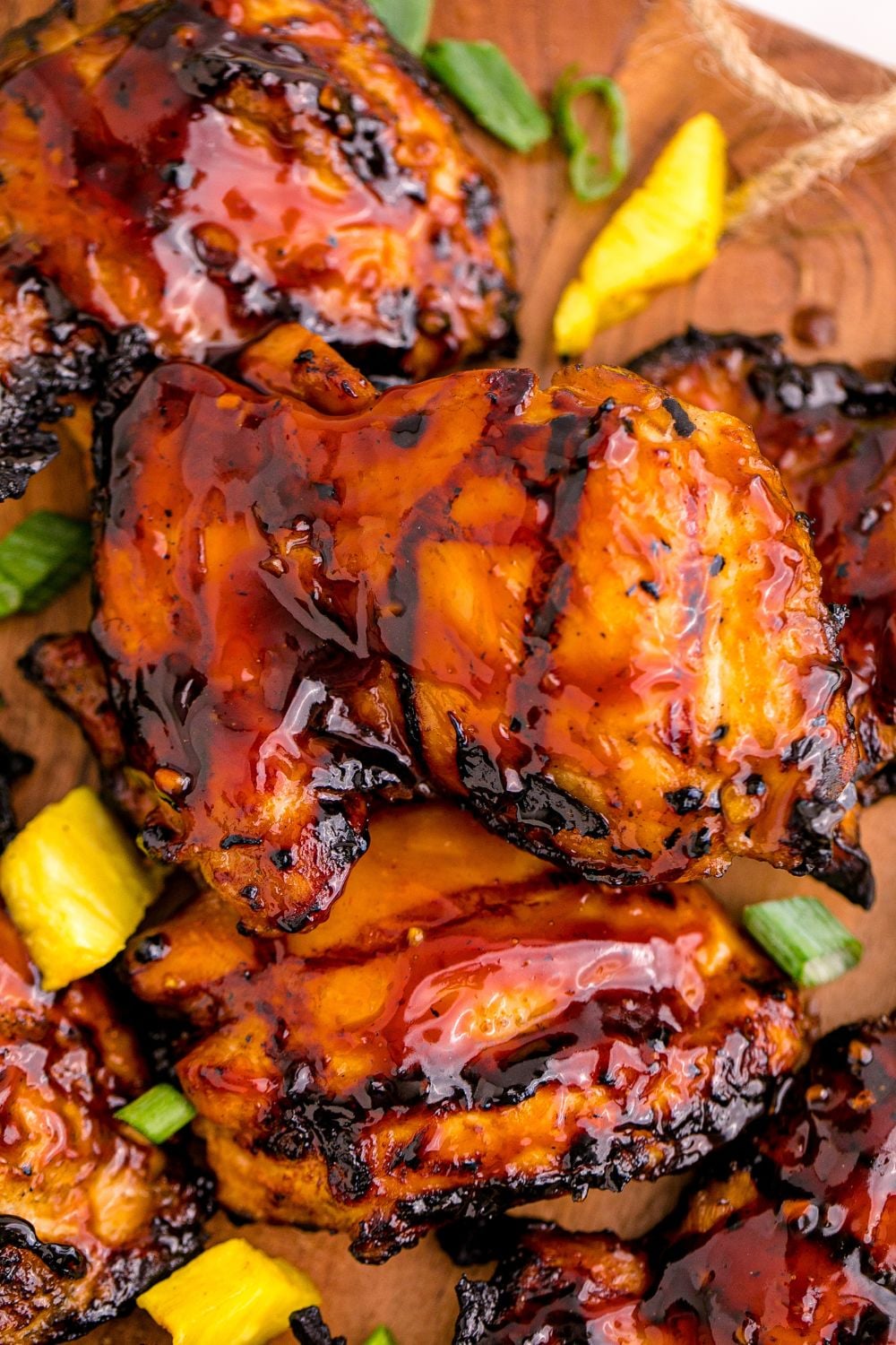 Huli Huli Chicken on table with diced pineapple around it