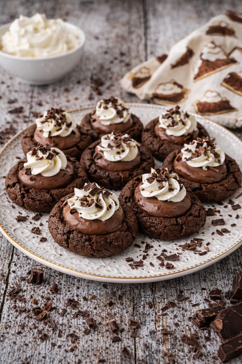 Chocolate Pie Cookies on a white plate on a wood table