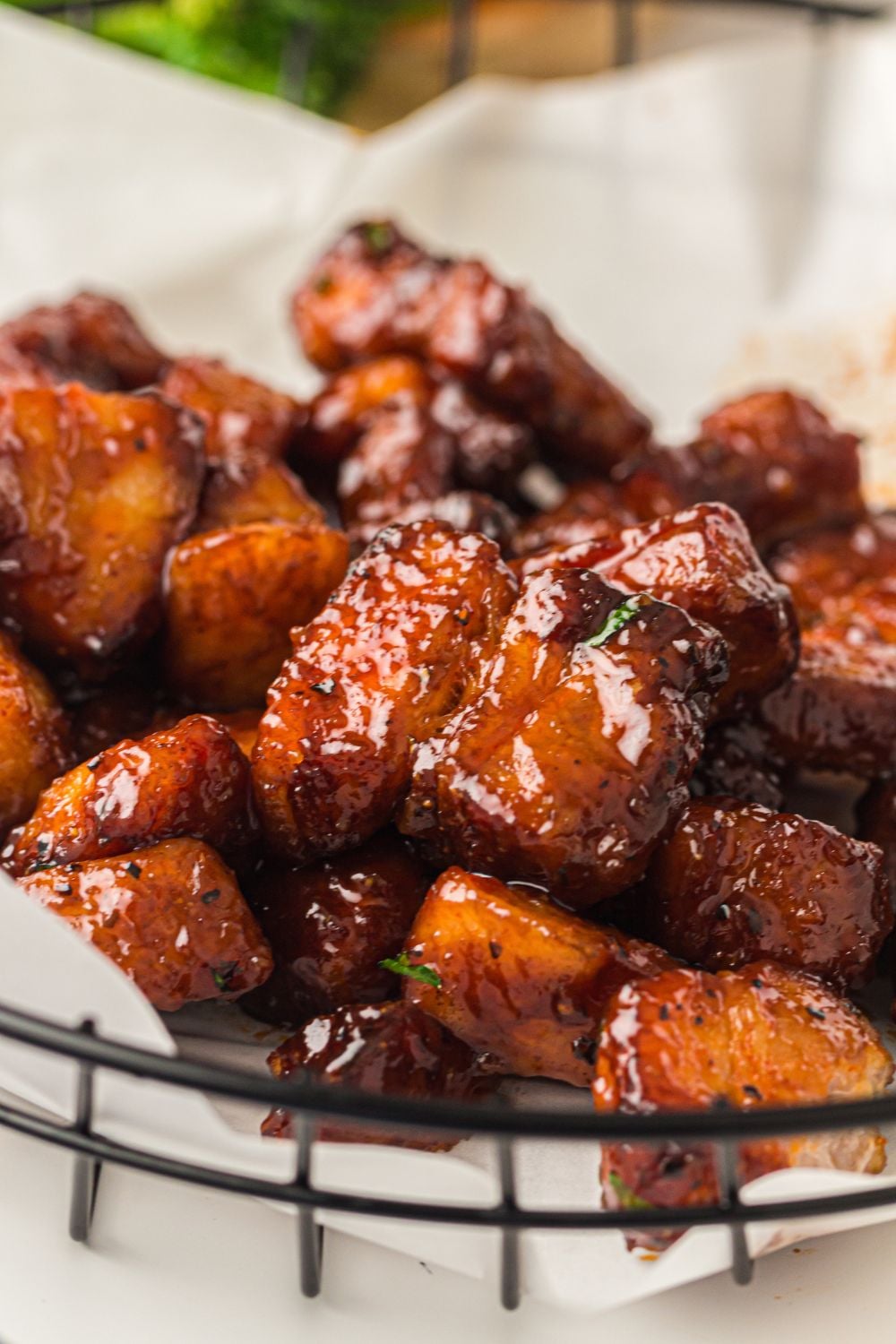 Smoked Pork Belly Burnt Ends in a basket with some parchment paper