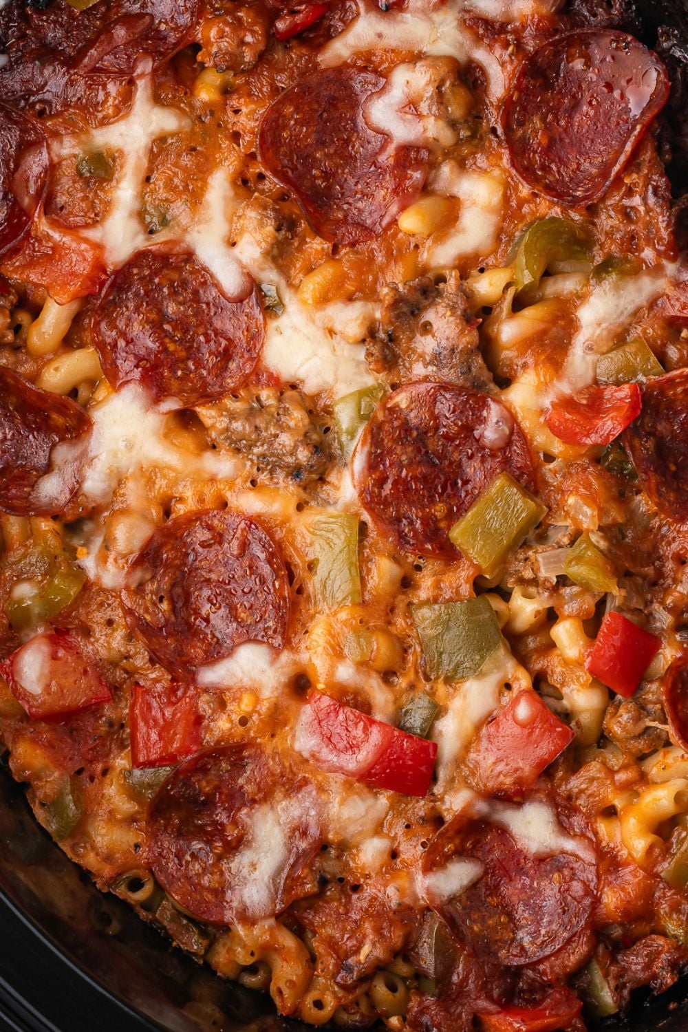pizza casserole in a slow cooker for a close up view of the mixture