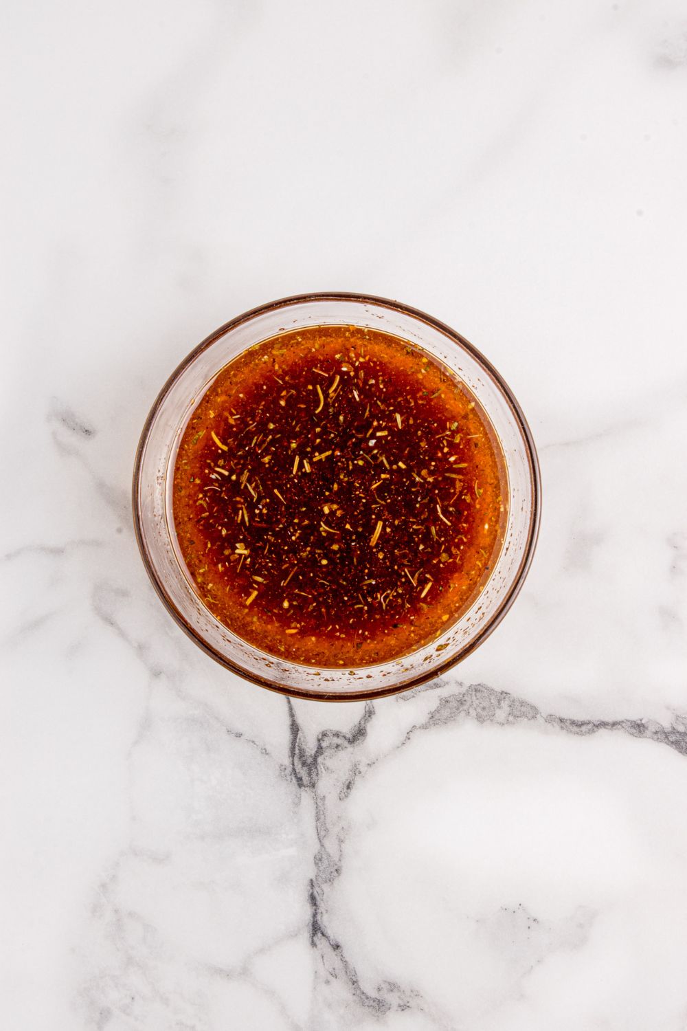 bowl with a liquid marinade in it 