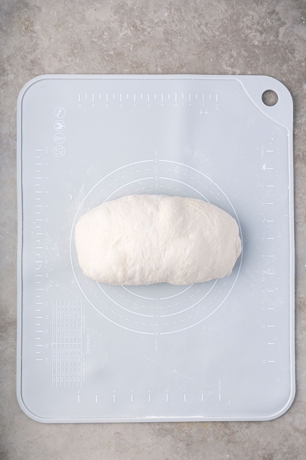 shaped Homemade Sourdough Bread dough on a cutting board