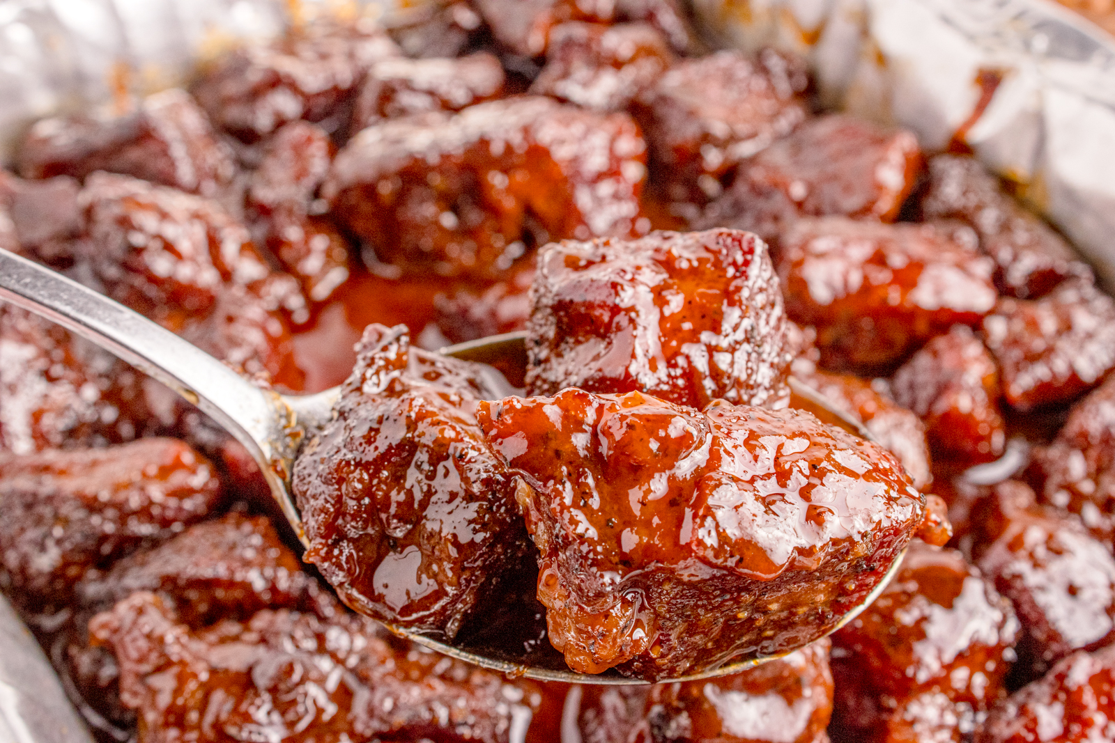 Up close shot of the Chuck Roast Burnt Ends on a spoon