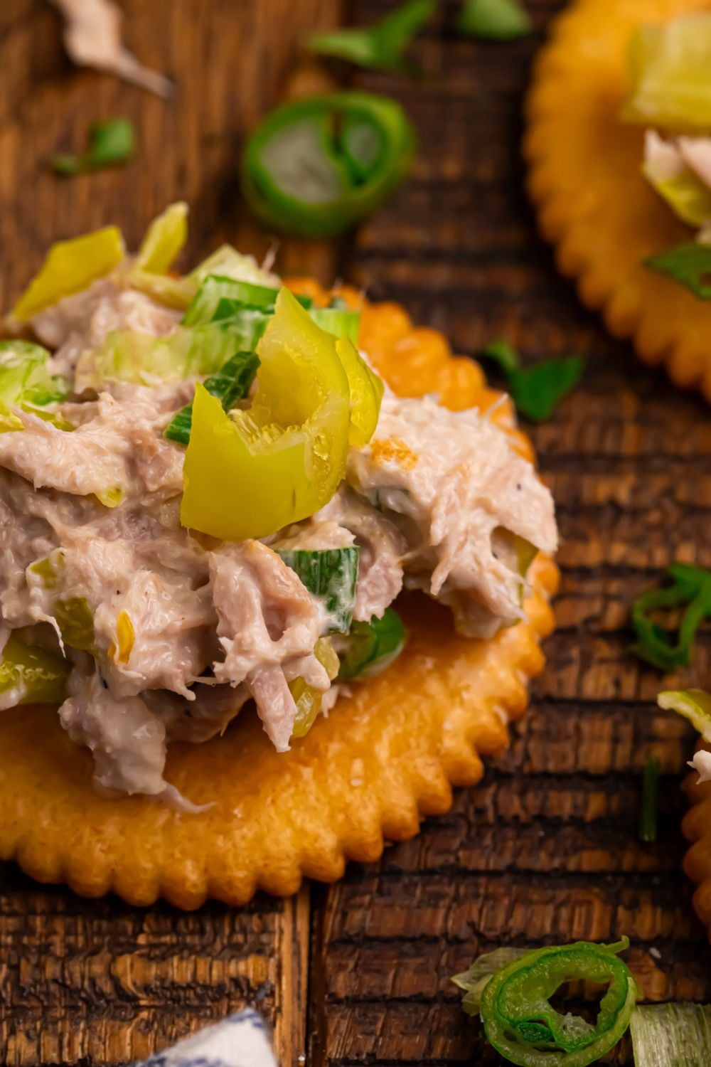 Pepperoncini Ranch Tuna Salad on a cracker sitting on table 