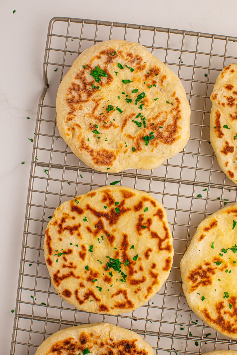 3 Ingredient Flatbread spread out on cooling rack on table
