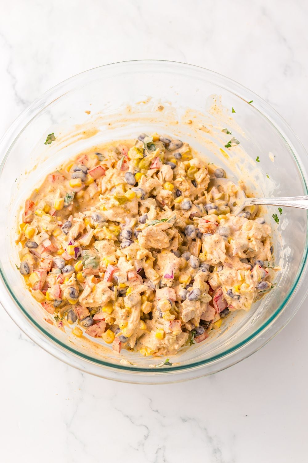 Creamy Taco Chicken Salad in a glass bowl mixed up
