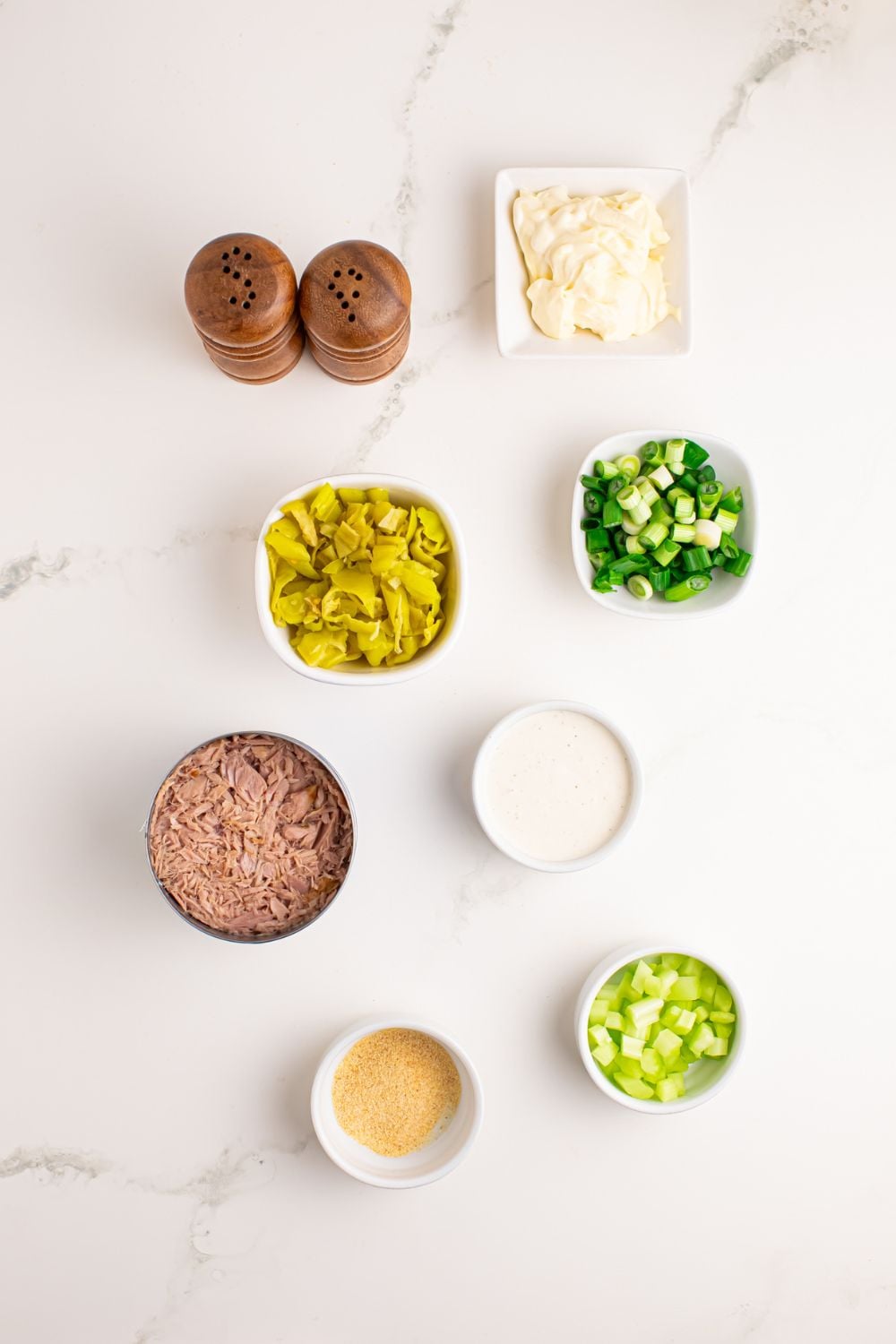 Pepperoncini Ranch Tuna Salad in small bowls sitting on a white table 
