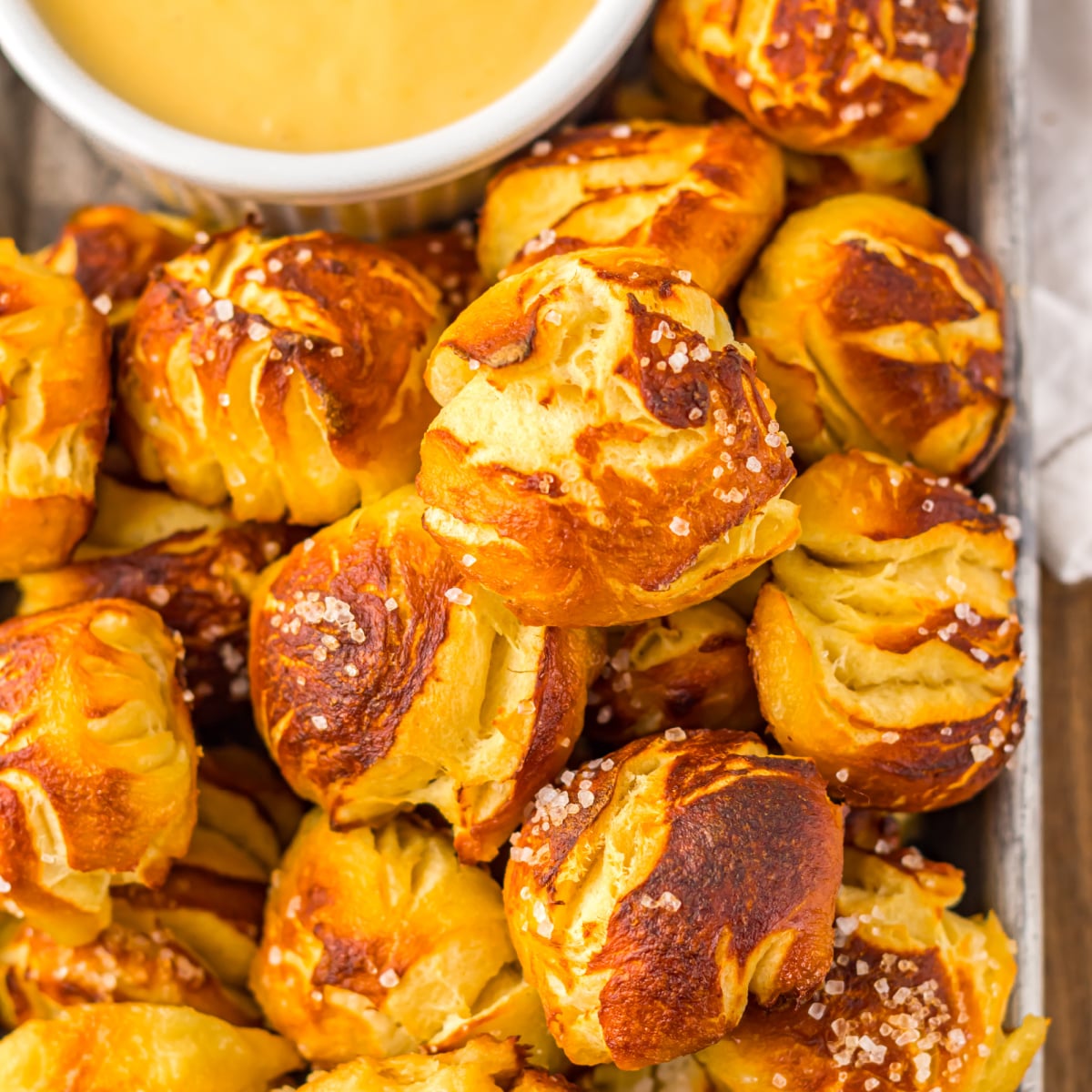 Easy Biscuit Pretzel Bites with Cheese Sauce