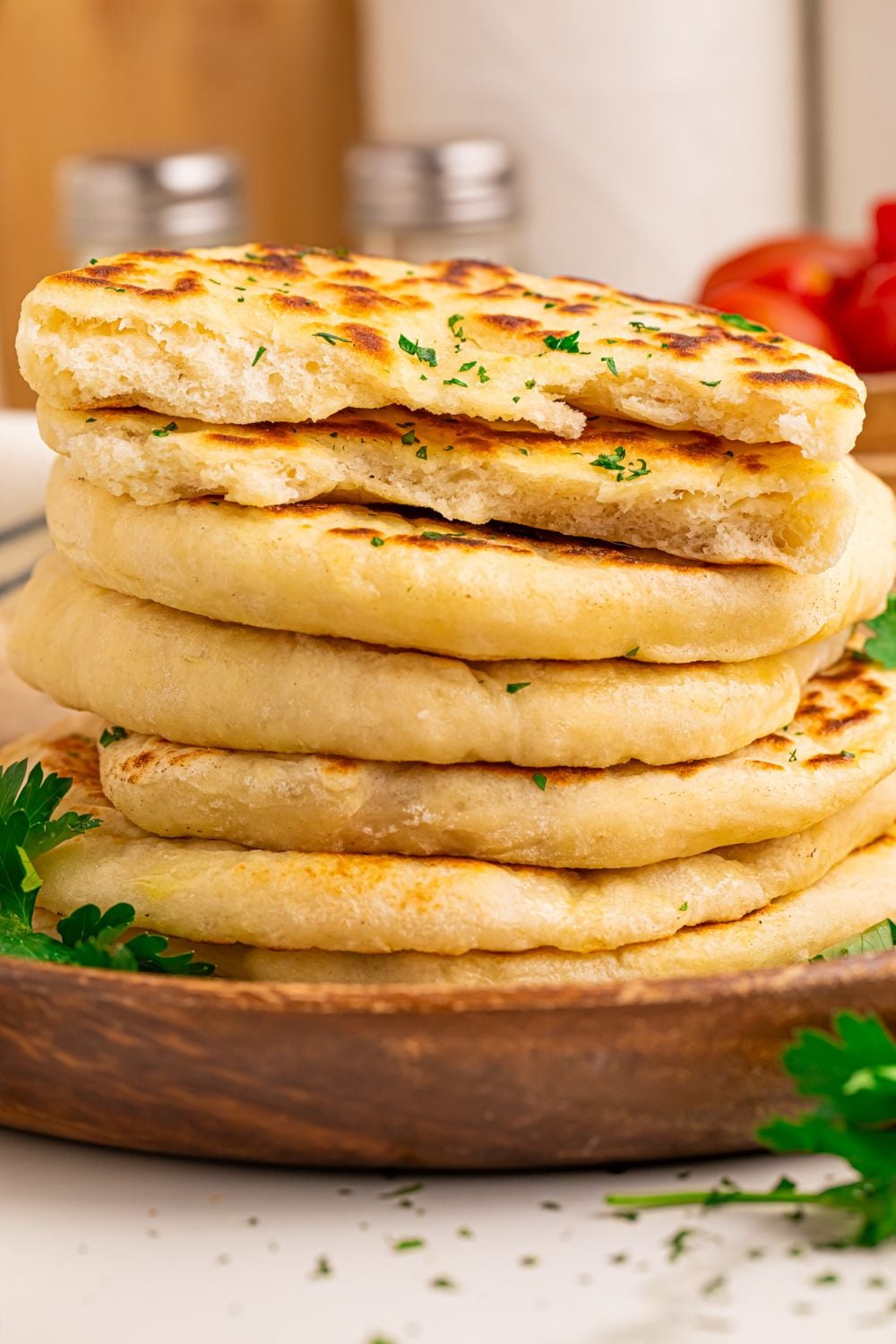 3 Ingredient Flatbread stacked on top of one another in a tower with parsley on top