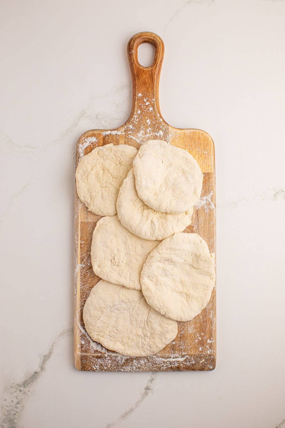 3 Ingredient Flatbread dough rolled out into circles on a cutting board