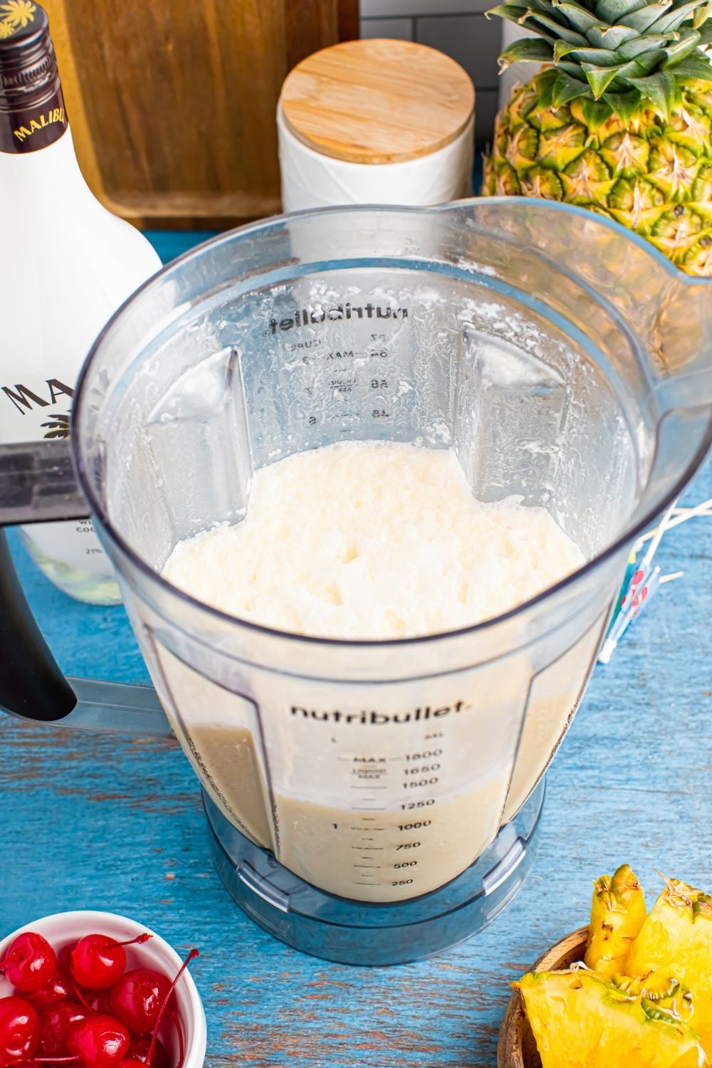 blender with Frozen Malibu Piña Colada mix in the container 