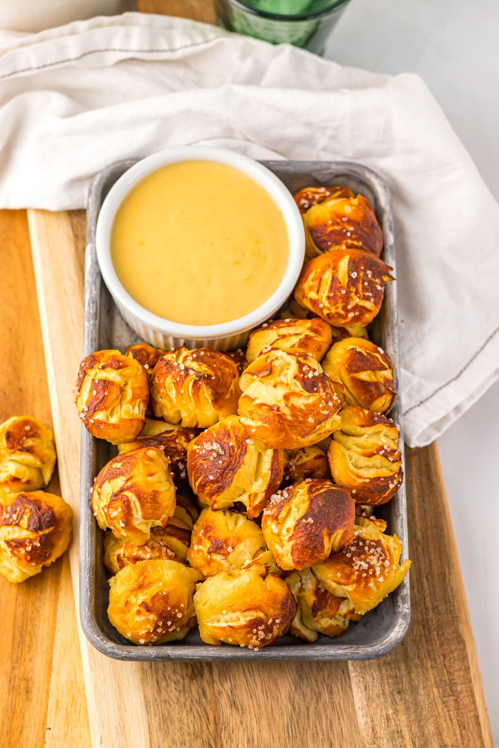 overhead look of Game day pretzel bites with cheese in a container