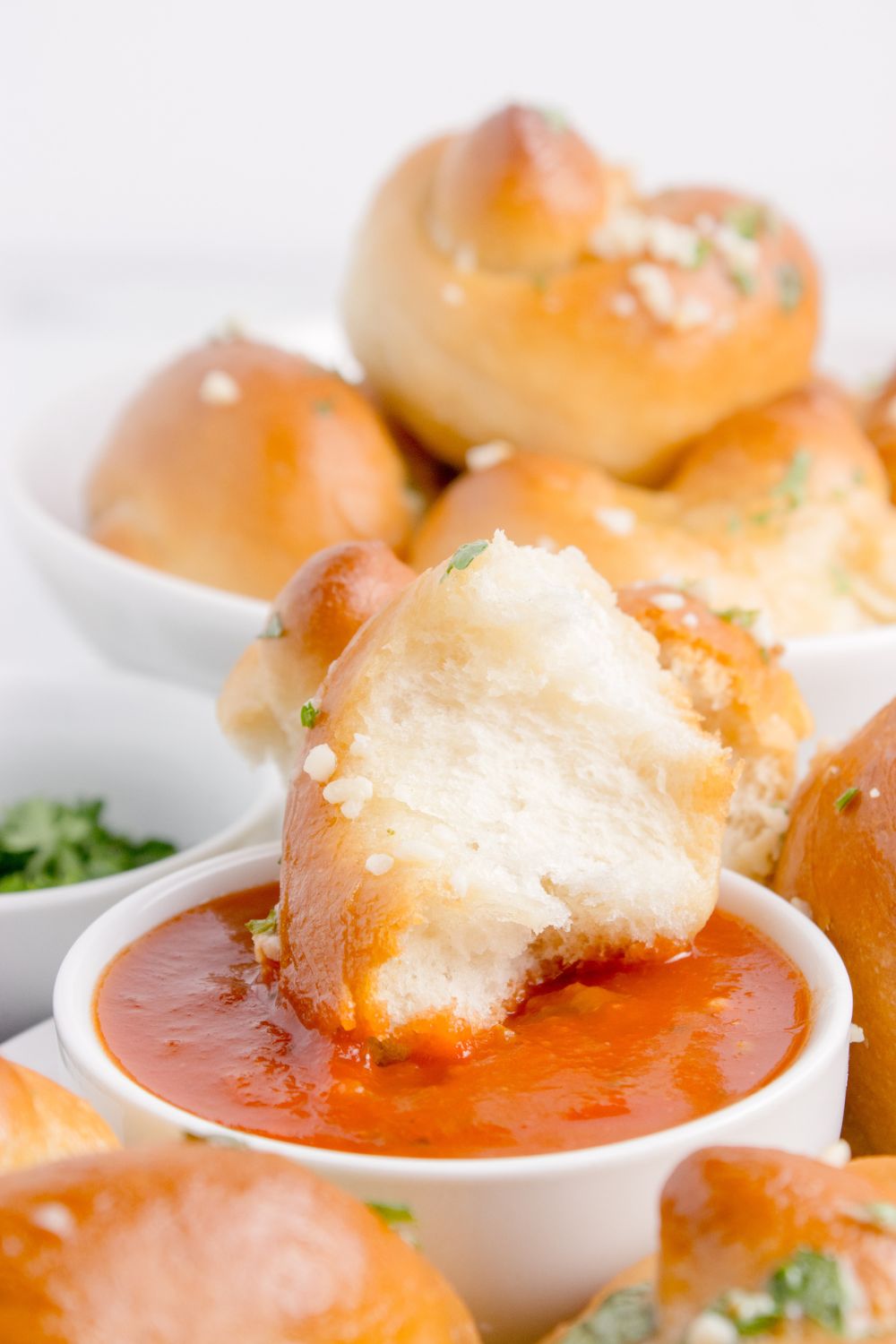 torn garlic knots in marinara sauce 