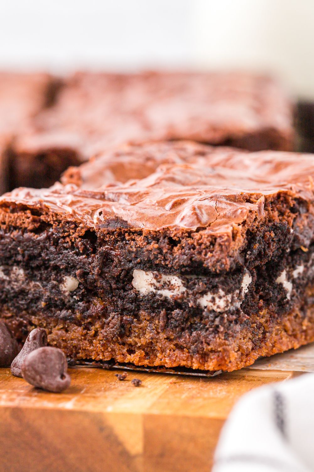 Slutty Brownies sliced and place on tray with a close up of the layers of brownies 