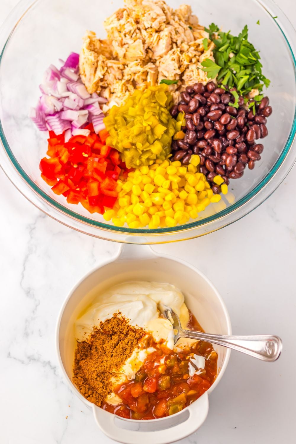 Creamy Taco Chicken Salad ingredients in a bowl and the dressing in another small bowl