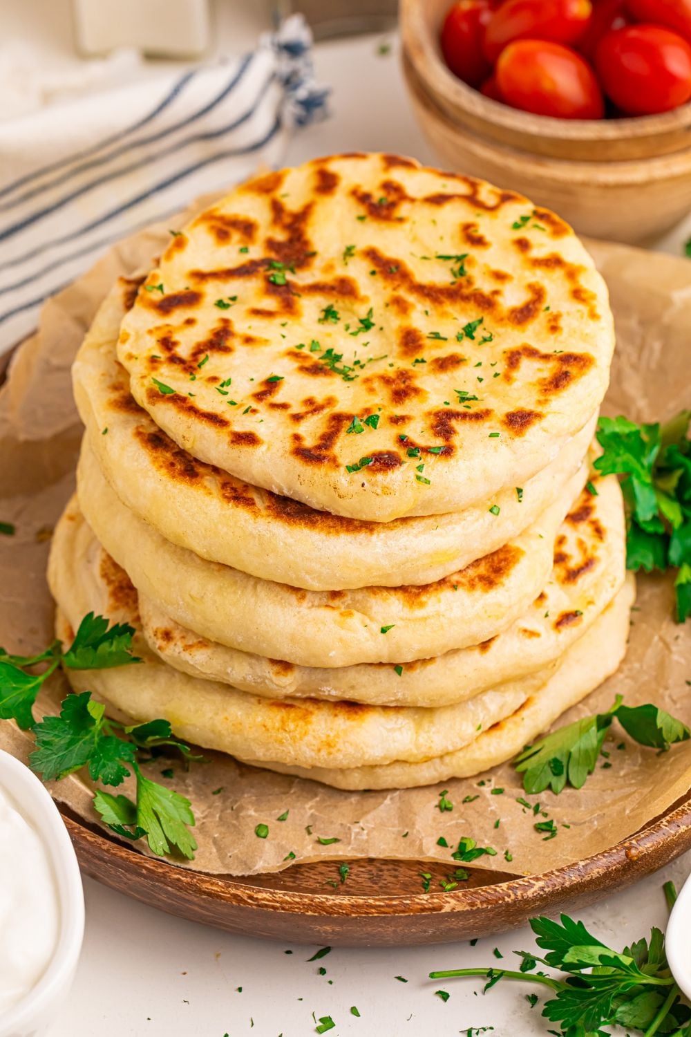 stack of 3 Ingredient Flatbread on tray with bowls of tomatoes to side