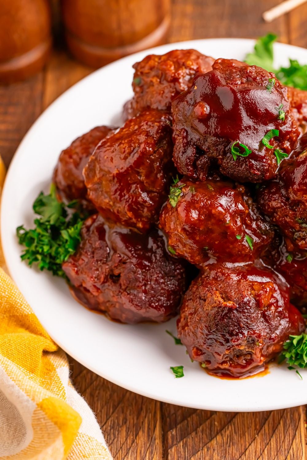 Crockpot Homemade BBQ Meatballs on a plate garnished with some parsley