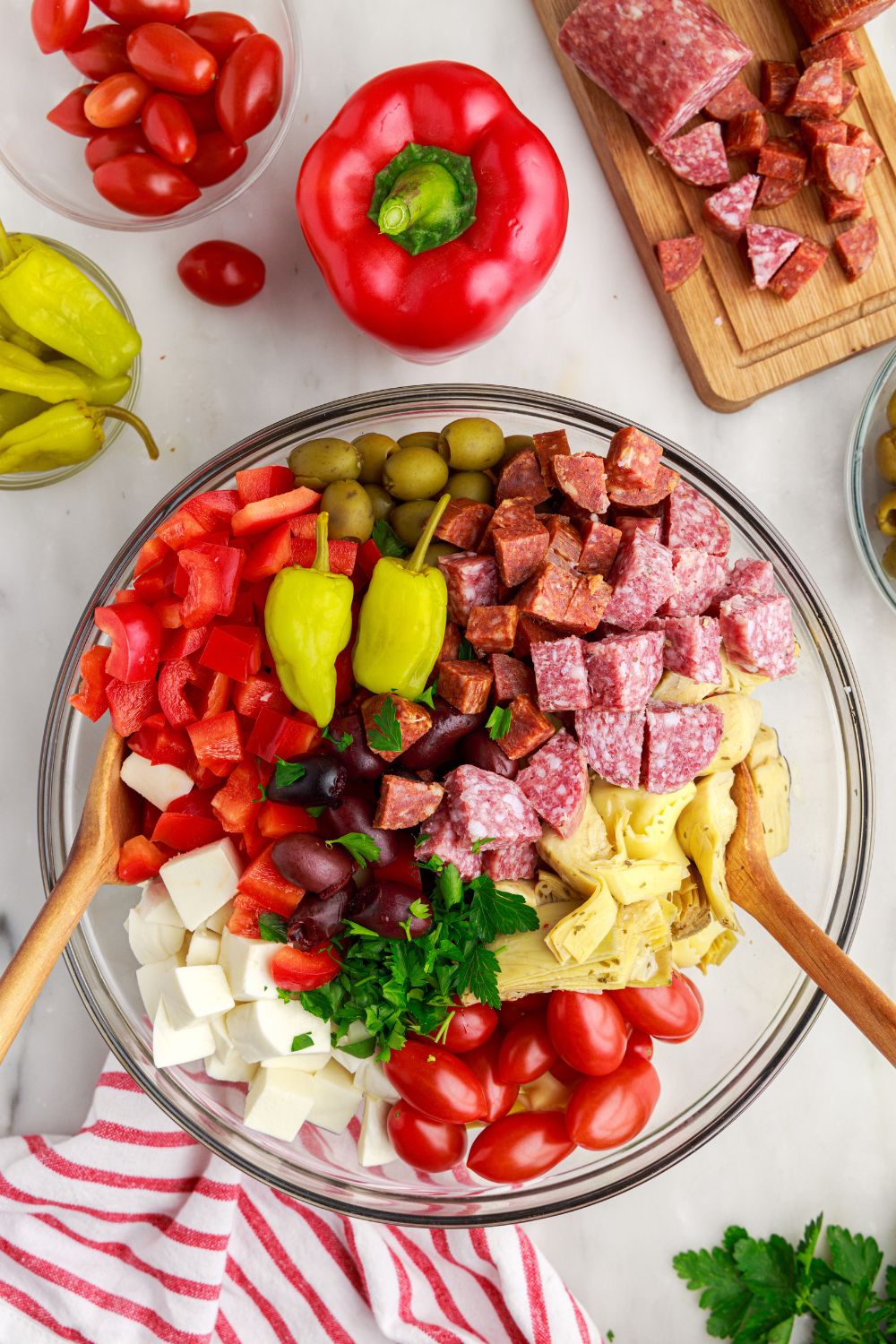 mixing bowl of Antipasto Tortellini Pasta Salad in a glass bowl 