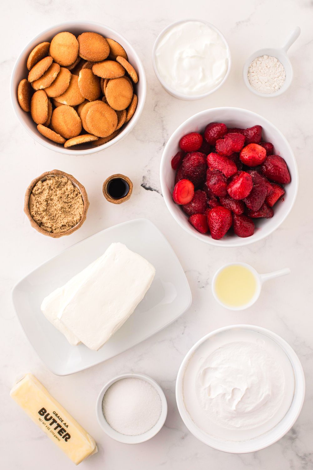 No Bake Strawberry Cheesecake ingredients in single serve bowls on table