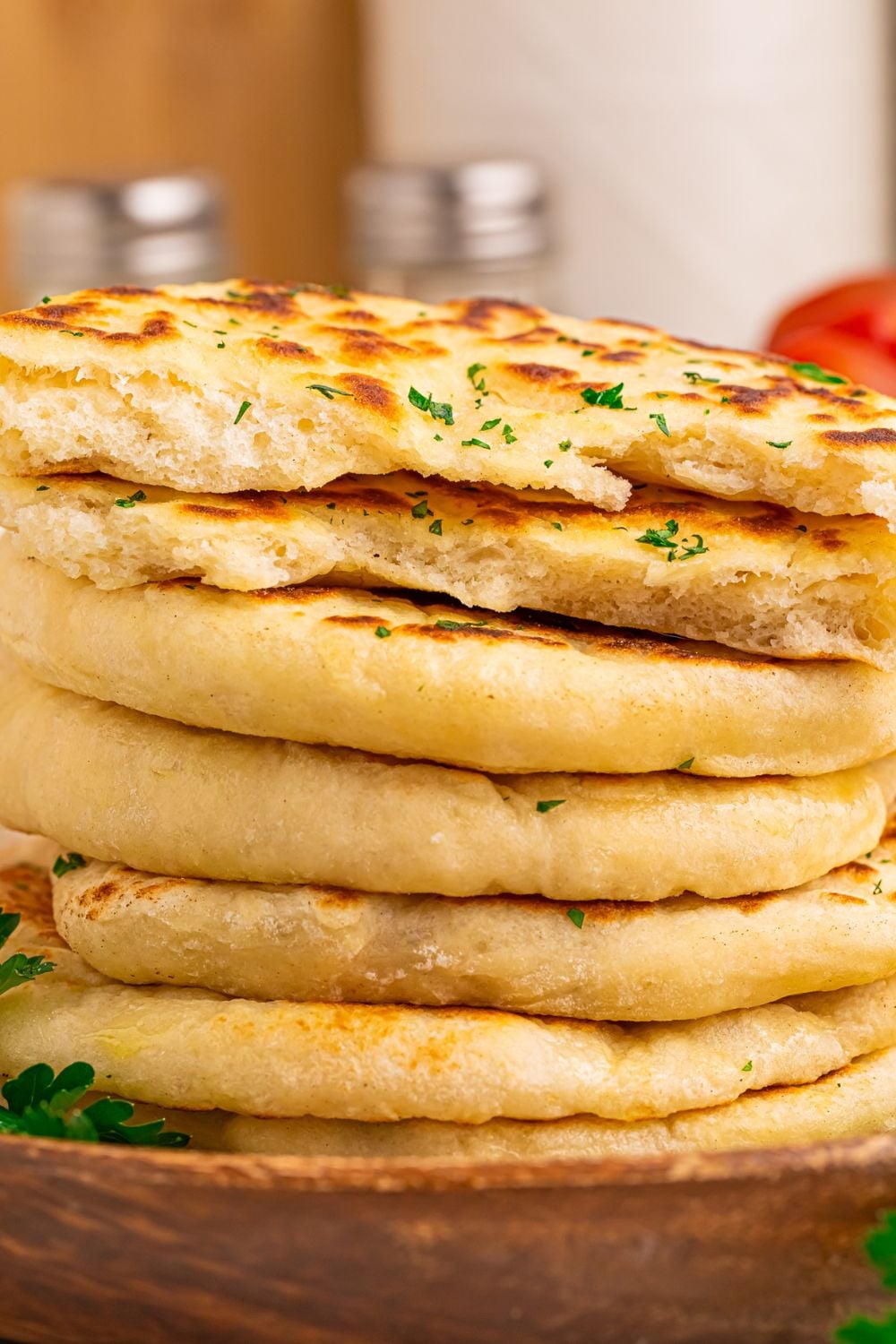 3 Ingredient Flatbread stacked on tray but some sliced in half