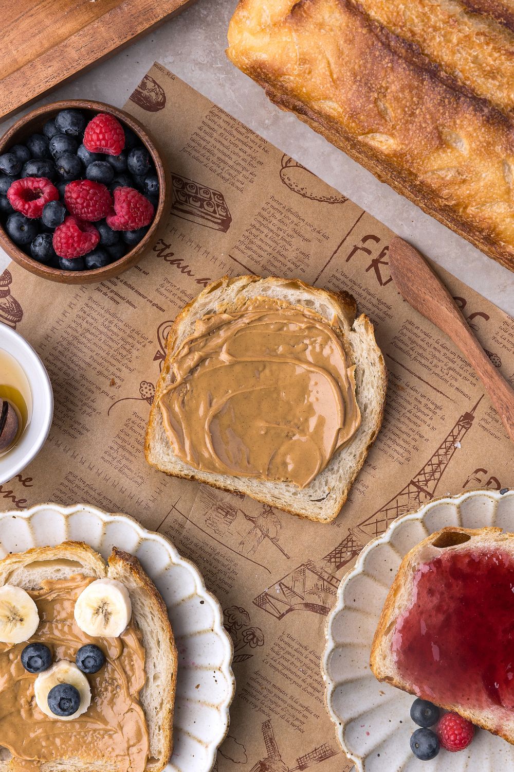 bread decorated with peanut butter and fruit to look like a bear, more bread with jam, and more Homemade Sourdough Bread with peanut butter 