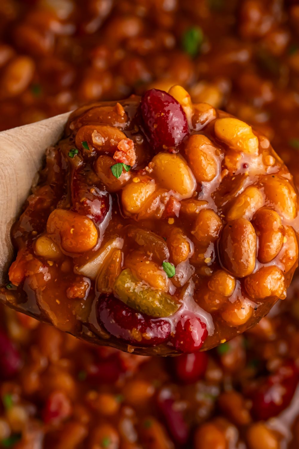 spoon with some Smoky baked beans with bourbon on them