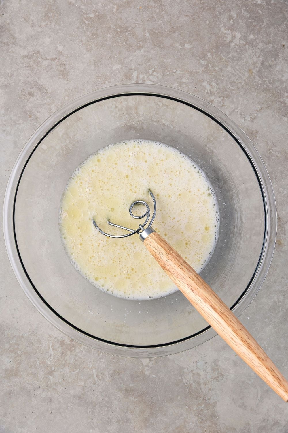 wet ingredients in a bowl for making Homemade Sourdough Bread