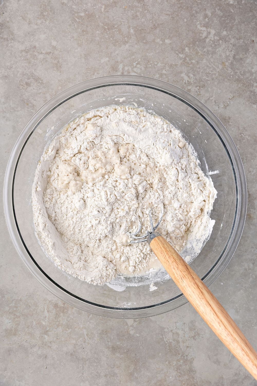 dry ingredients for making Homemade Sourdough Bread in glass bowl on table 