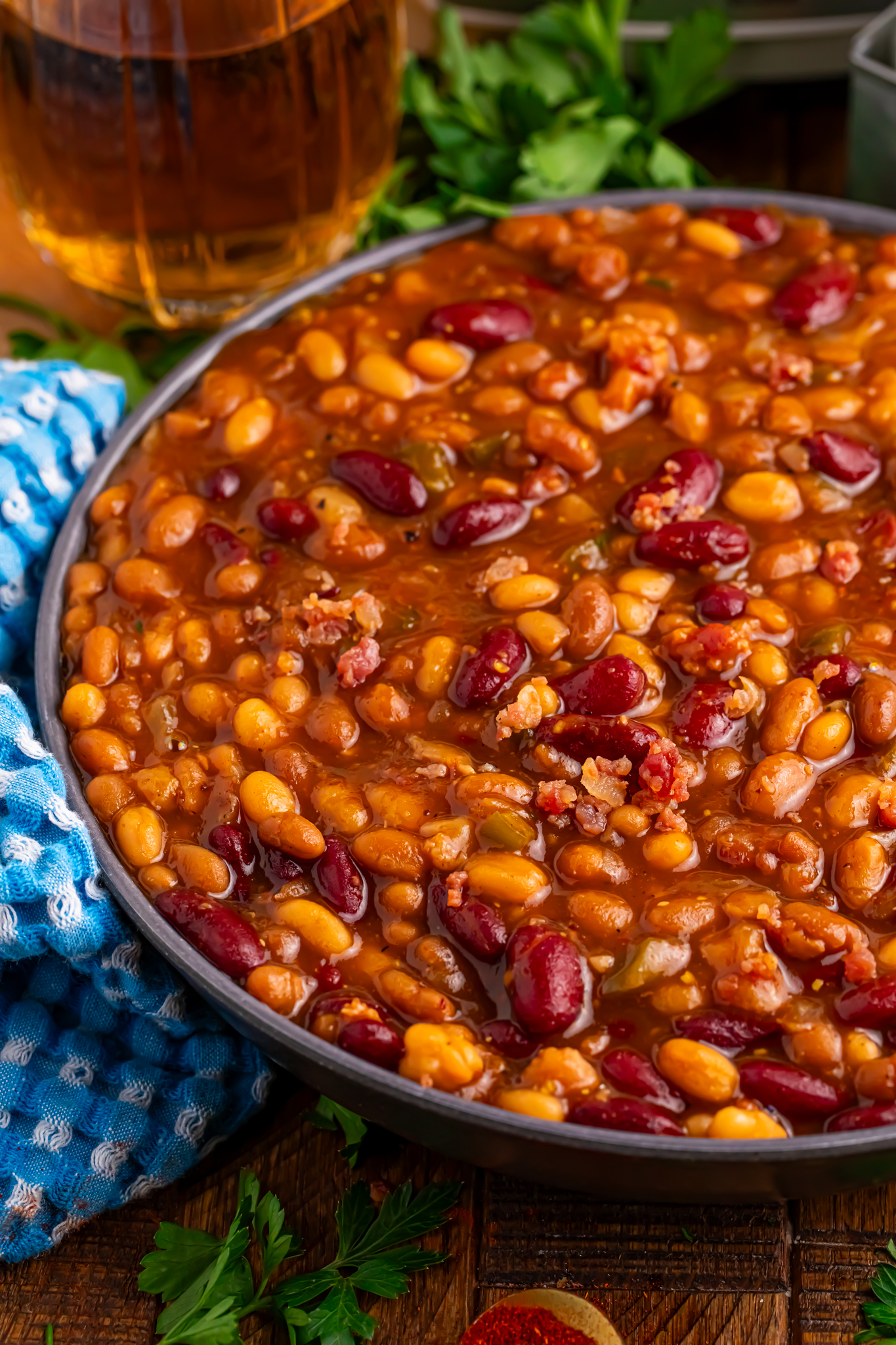 Crockpot bourbon baked beans in a large serving bowl