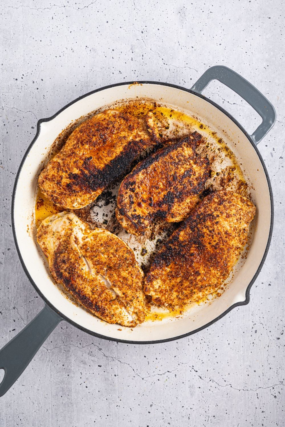 cooked chicken in a skillet for Cheesy Salsa Chicken