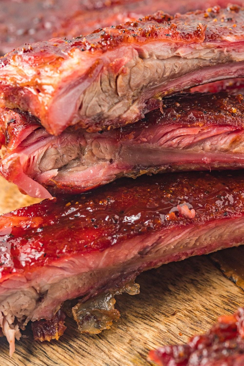 close up of Grilled BBQ Baby Back Ribs to show the juicy meat