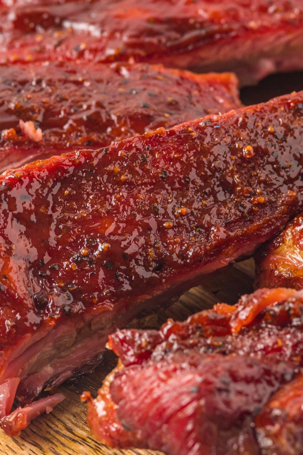 close up of Grilled BBQ Baby Back Ribs to show the sticky sauce