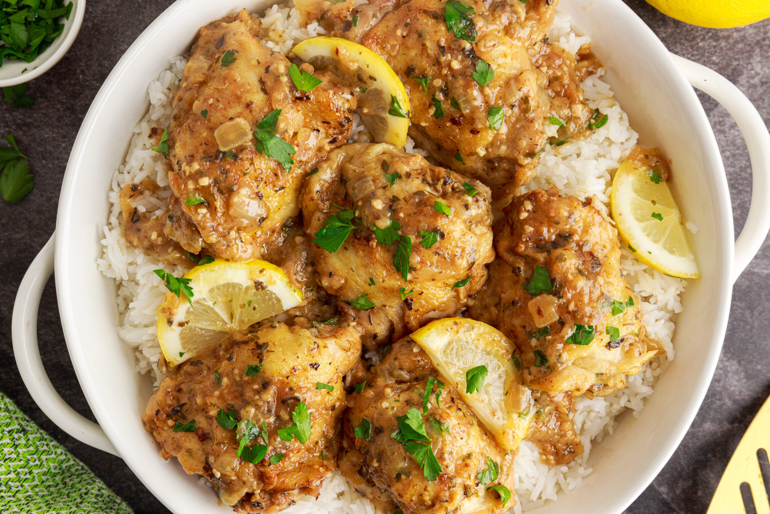 Overhead shot of the Instant Pot Lemon Butter Chicken in a white serving dish sitting on a table