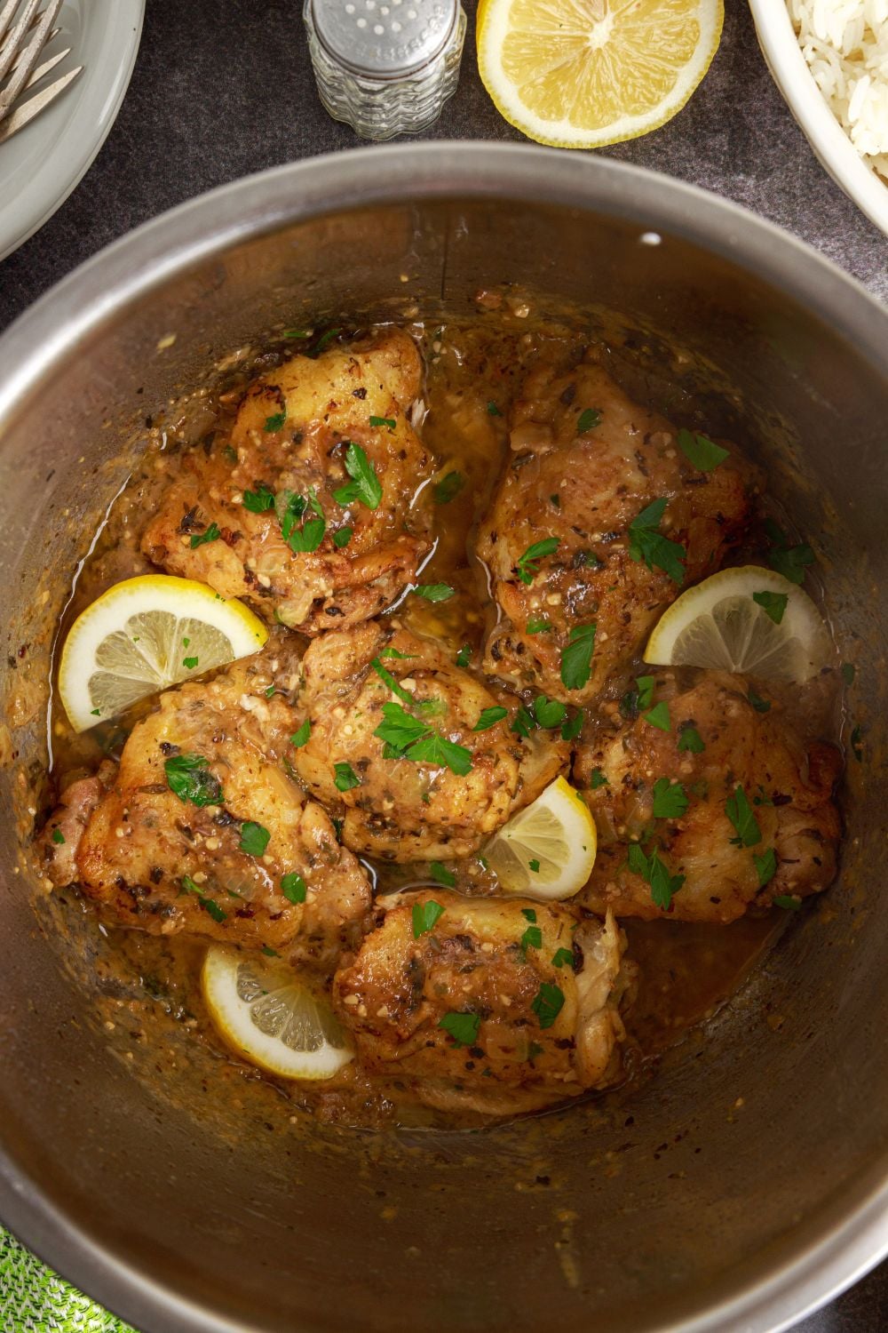 Instant Pot Lemon Butter Chicken in an instant pot topped with some sliced lemons