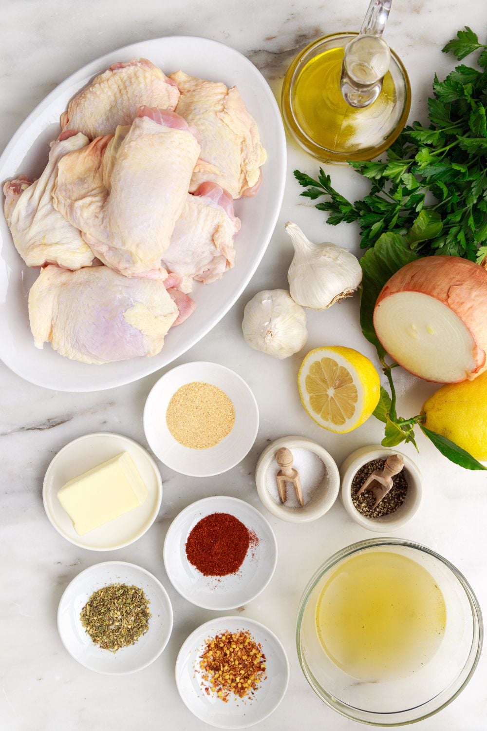 all the ingredients to make a Instant Pot Lemon Butter Chicken in single serve containers on table
