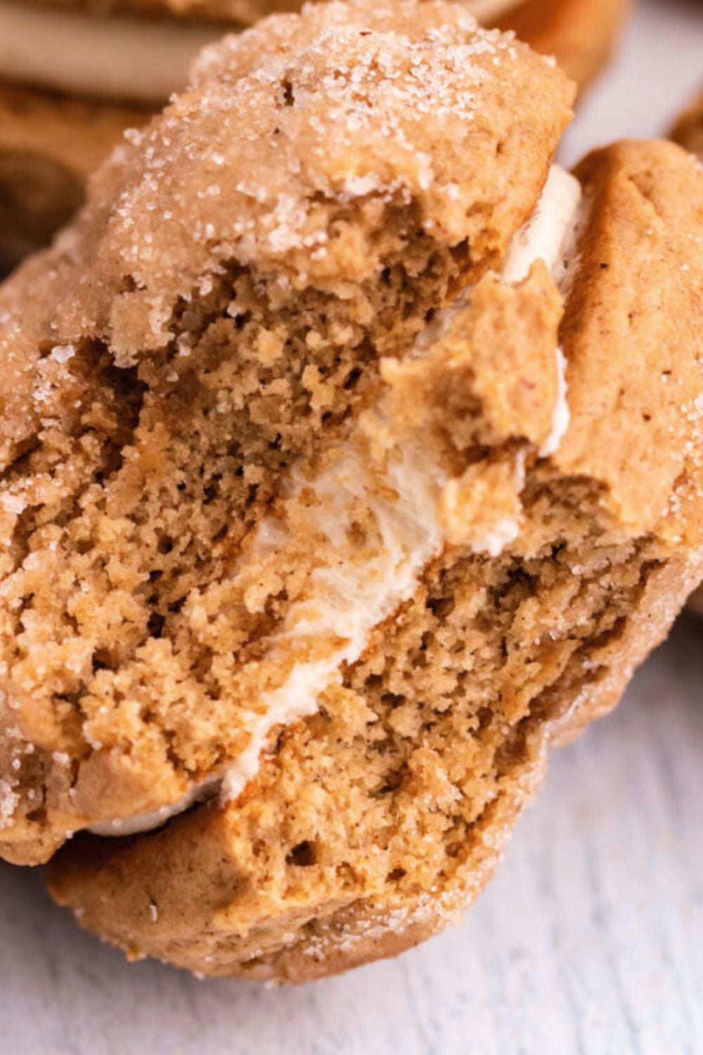 Apple Cider Whoopie Pie sat on the side with a bite taken out of it