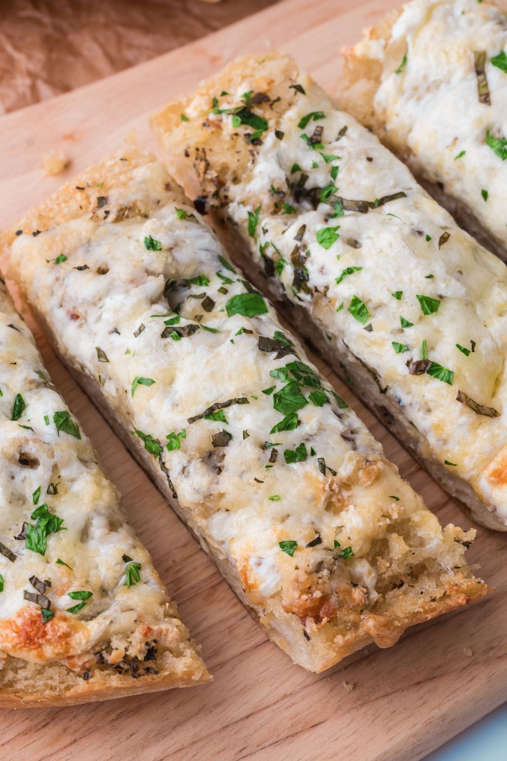 Cheesy Garlic Bread sliced and placed on a cutting board