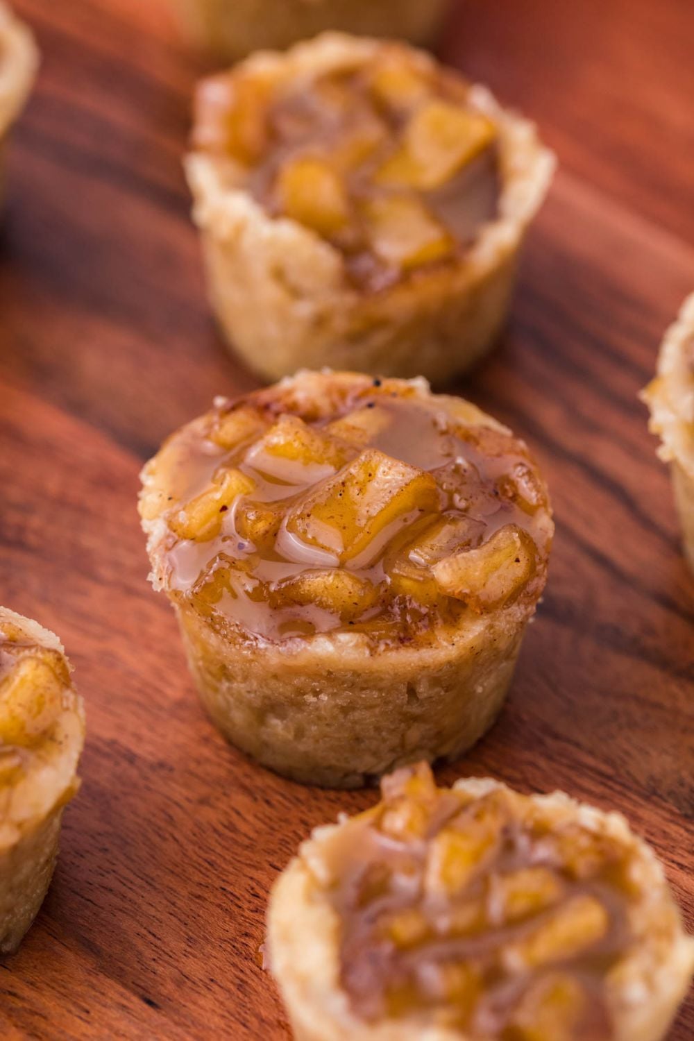 Mini Apple Crisp Bites spread out on a wooden table