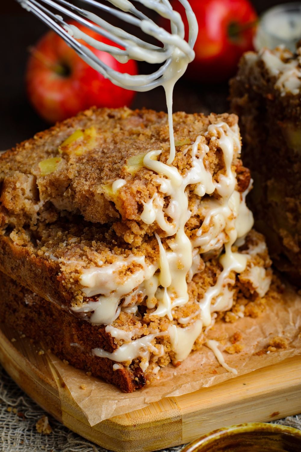 Apple Cinnamon Loaf Cake stacked 3 pieces and a bit of a glaze drizzling down onto the bread