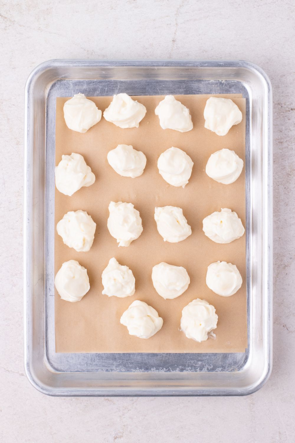 cheesecake batter for cookies on baking tray in balls