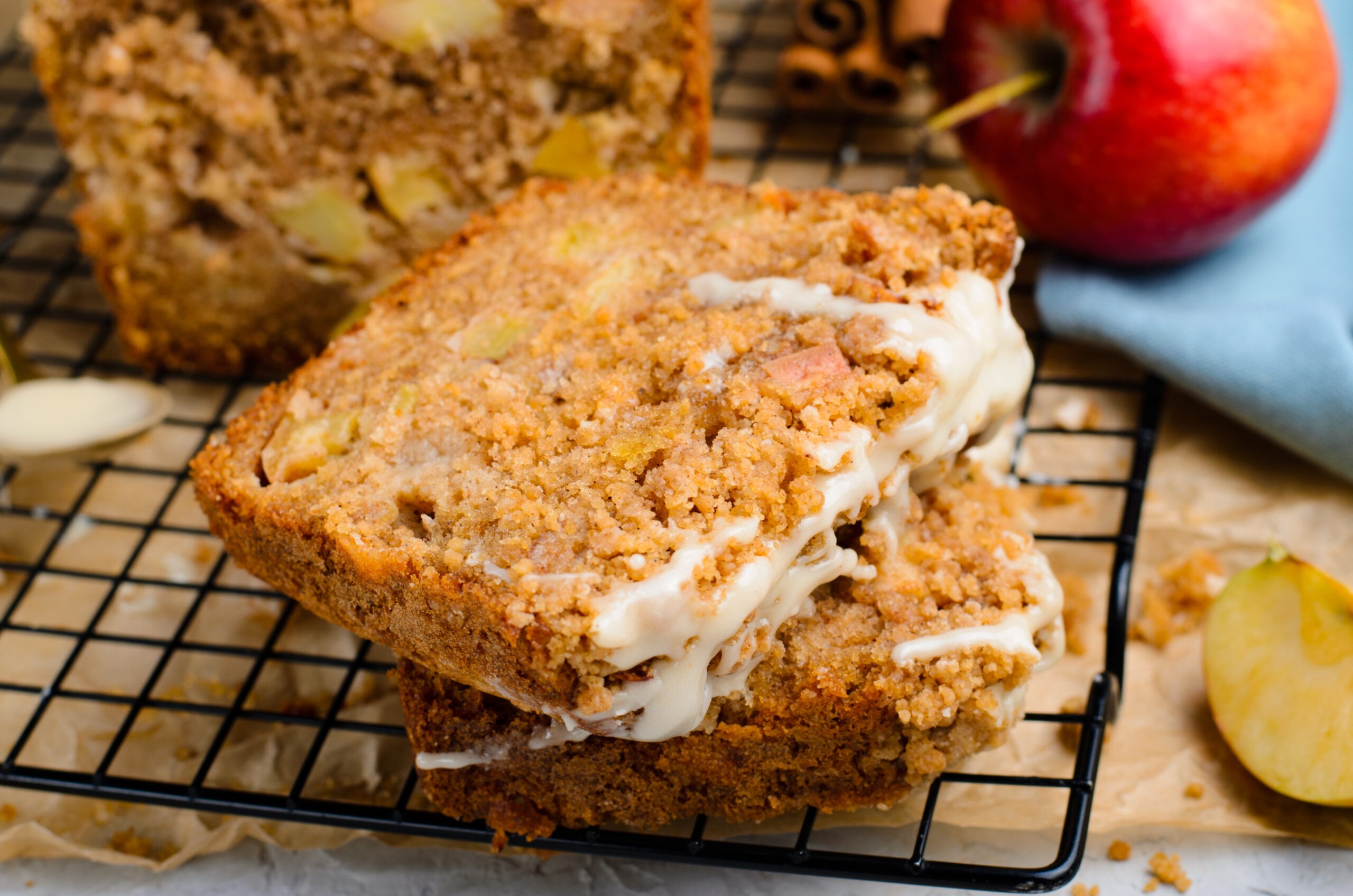 close up view of 2 slices of the Apple Cinnamon Loaf Cake on a cooling rack