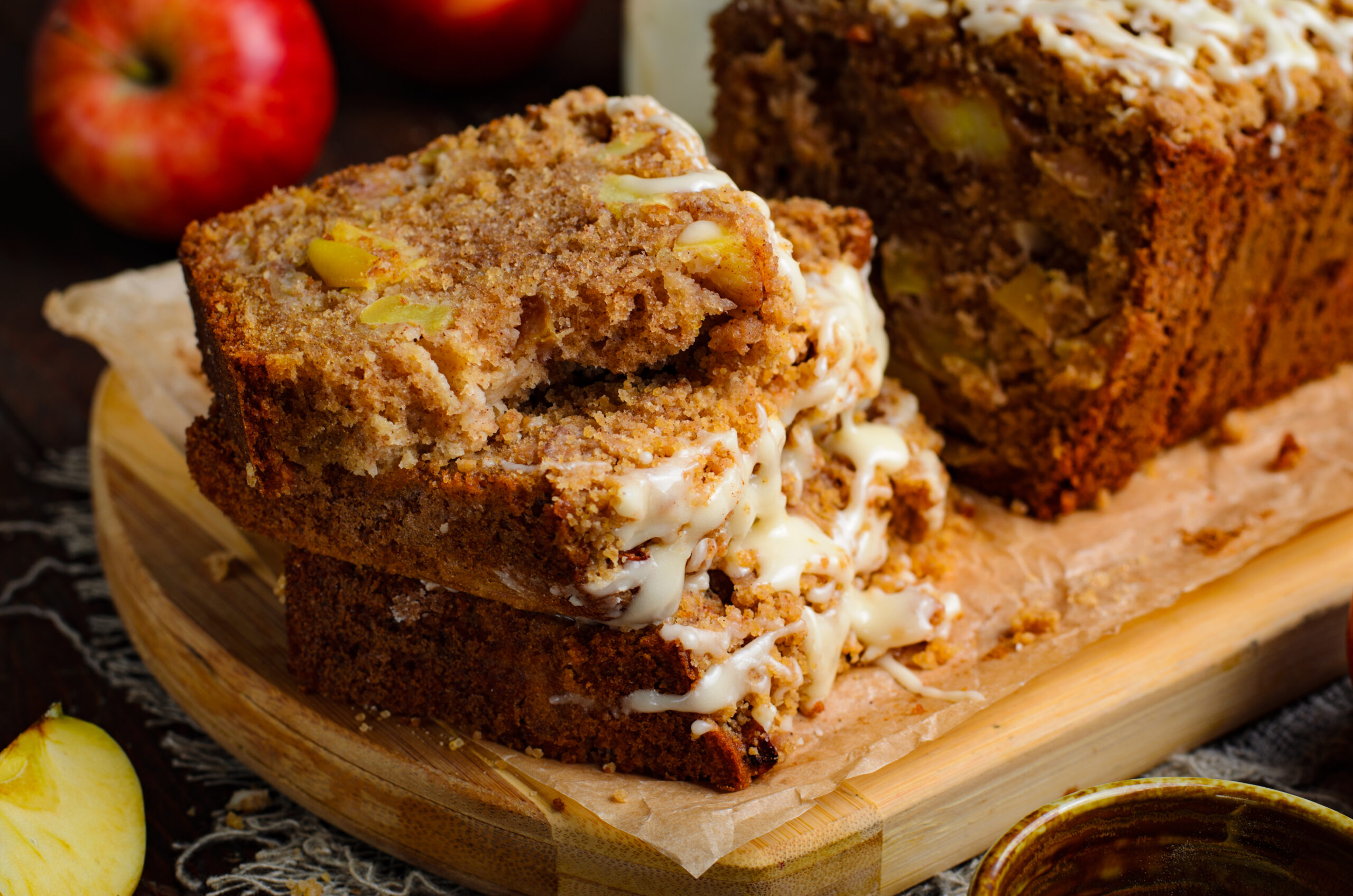 close up view of 4 stacked slices of the Apple Cinnamon Loaf Cake with glaze
