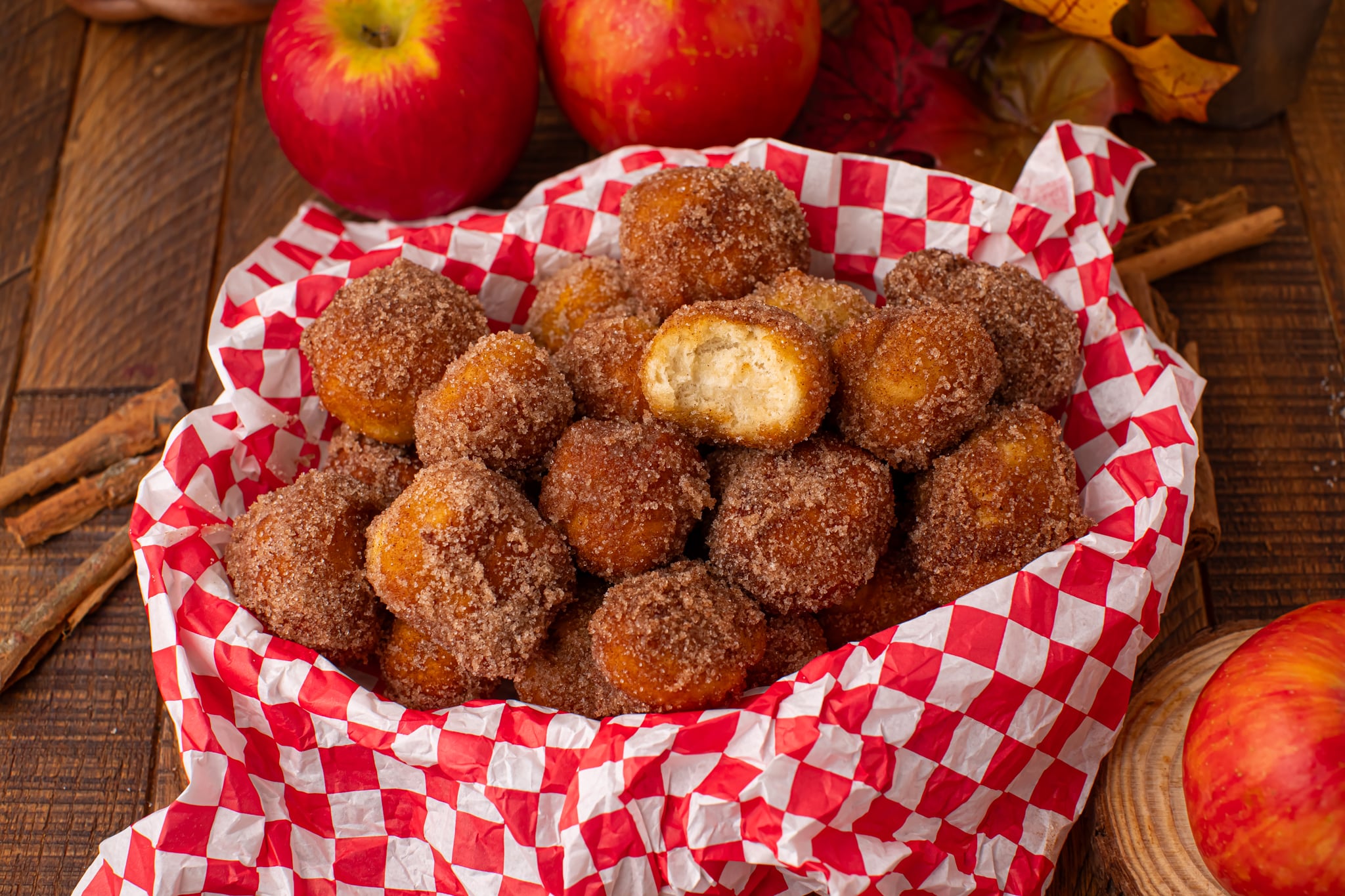 basket full of Apple Pie Donut Holes in a checked serving basket 