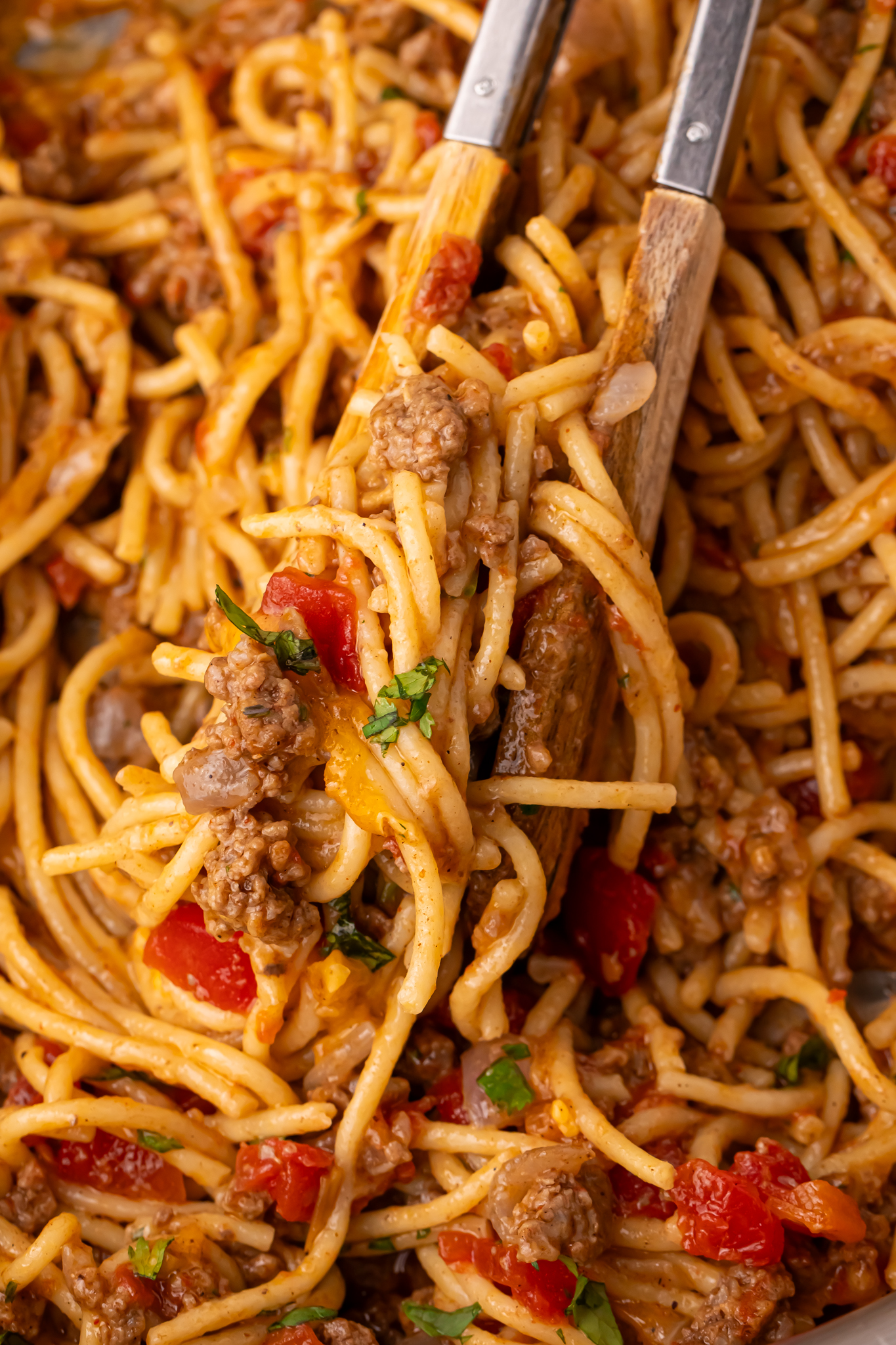 Cheesy Taco Spaghetti being lifted up by a spaghetti spoon
