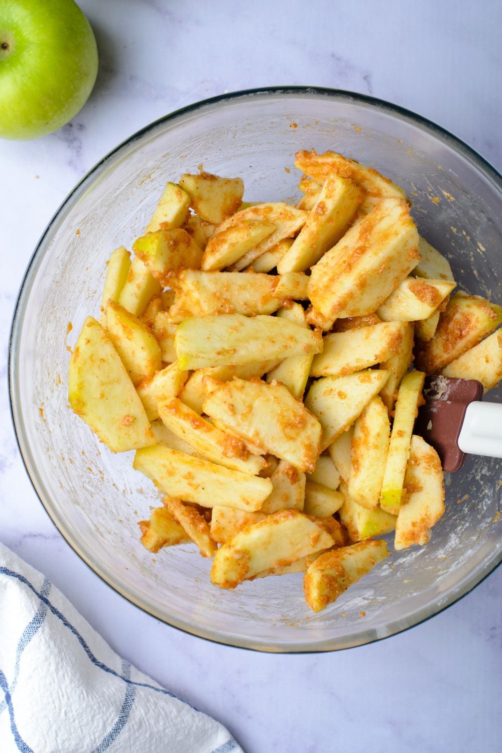 sliced apples tossed in a cinnamon mixture